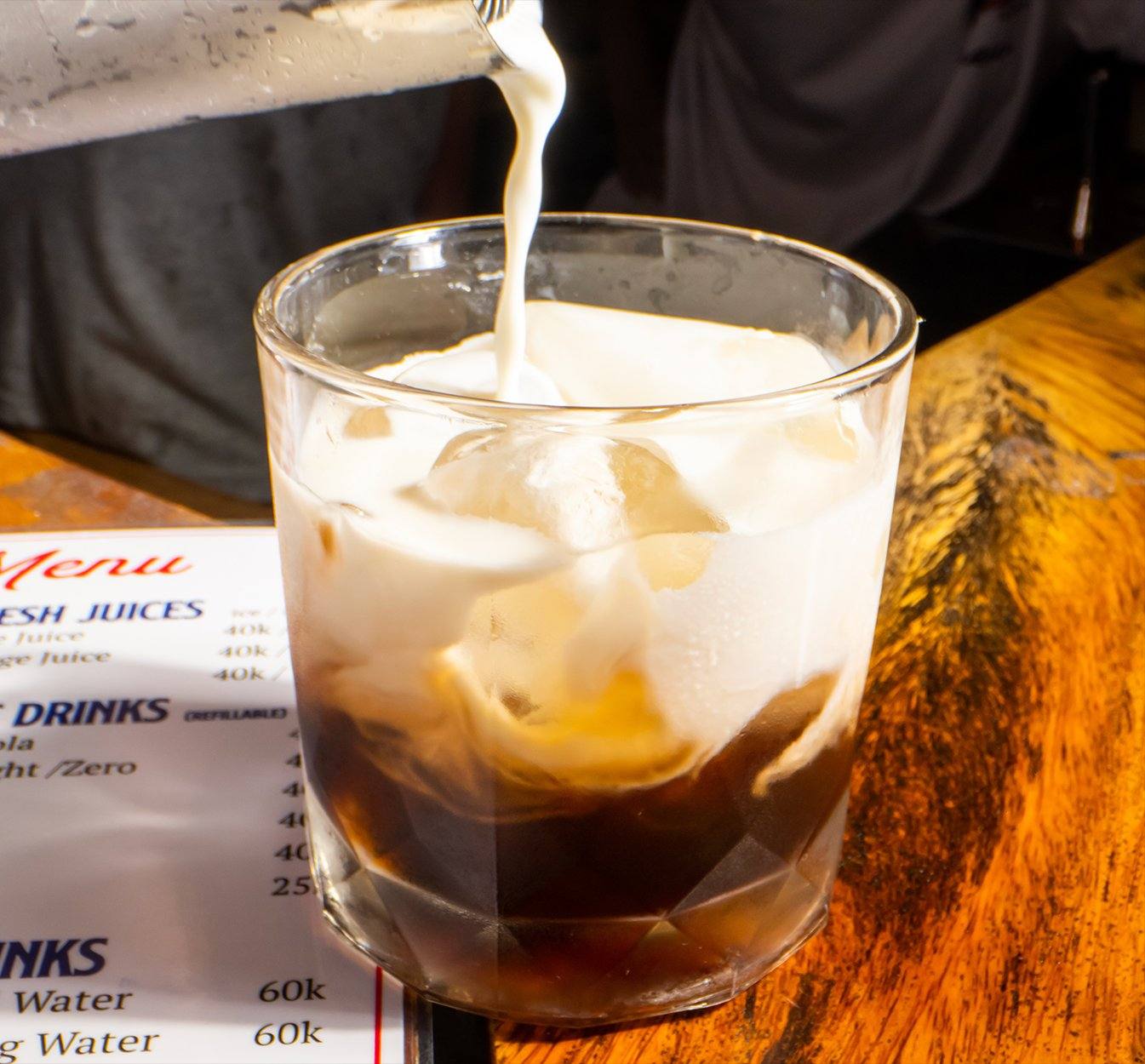White Russian cocktail recipe Coffee Liqueur Saigon Spirits cream pour rocks glass Vietnam bar Southeast Asia